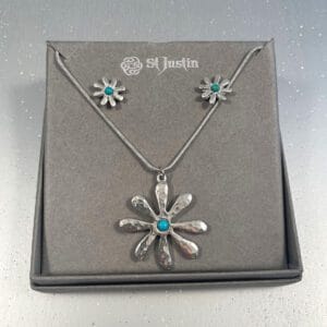 dahlia flower pendant and earrings set with central turquoise gemstone