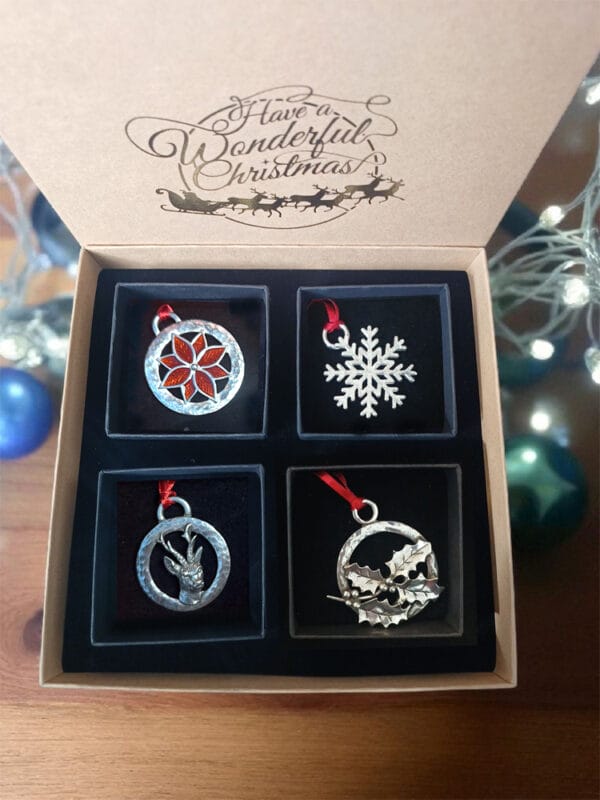 Christmas decorations gift box containing four individual pewter decorations