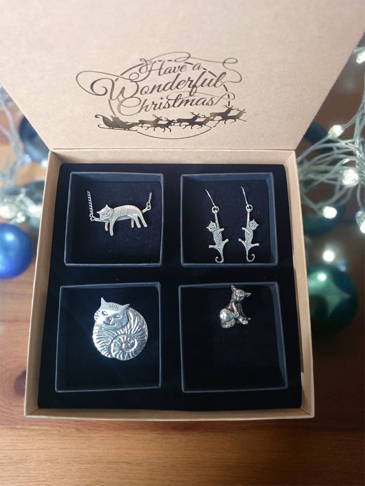 Christmas cats gift box containing four pewter cat items